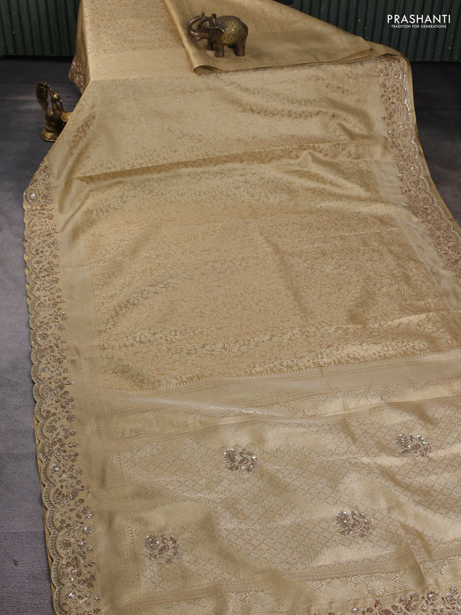 Kanchipuram silk saree gold with allover zari woven brocade weaves and embroidered border