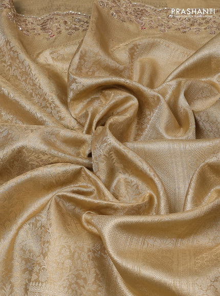 Kanchipuram silk saree gold with allover zari woven brocade weaves and embroidered border