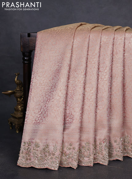 Kanchipuram silk saree pastel pink with allover zari woven brocade weaves and embroidered border