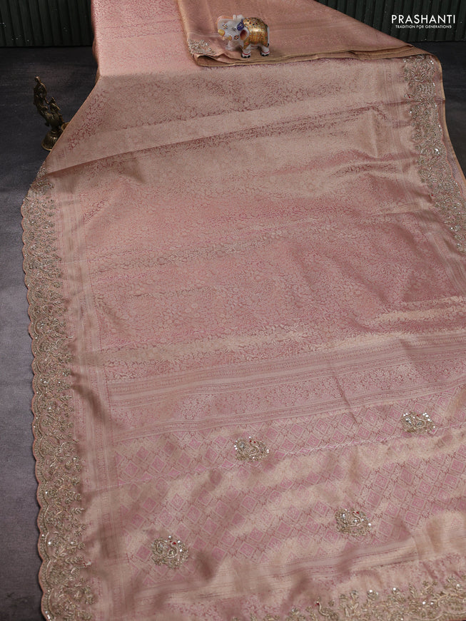 Kanchipuram silk saree pastel pink with allover zari woven brocade weaves and embroidered border