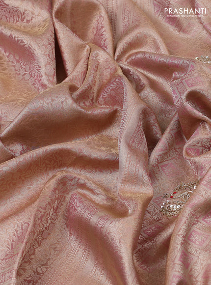 Kanchipuram silk saree pastel pink with allover zari woven brocade weaves and embroidered border