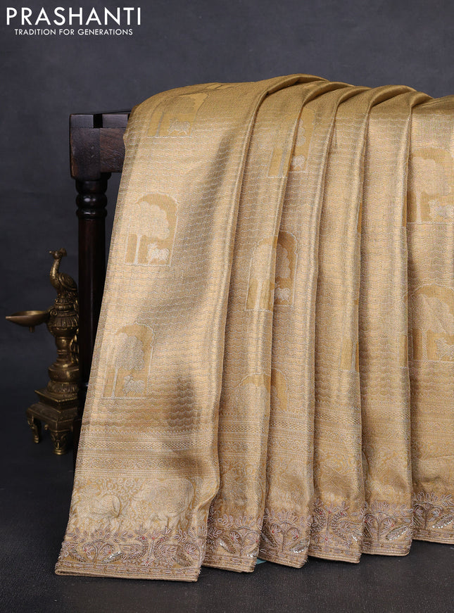 Kanchipuram silk saree gold with allover zari woven brocade weaves and embroidered border