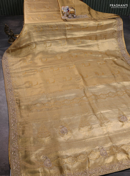 Kanchipuram silk saree gold with allover zari woven brocade weaves and embroidered border