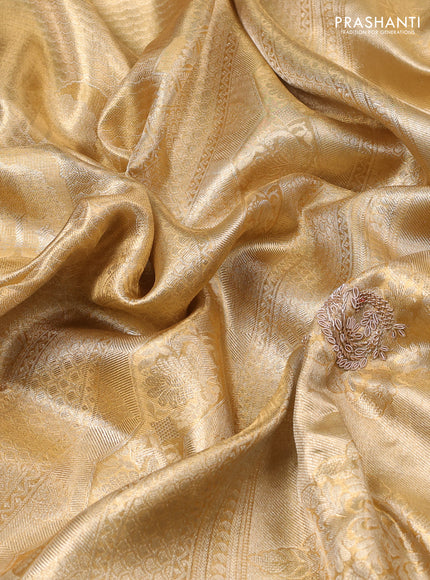 Kanchipuram silk saree gold with allover zari woven brocade weaves and embroidered border