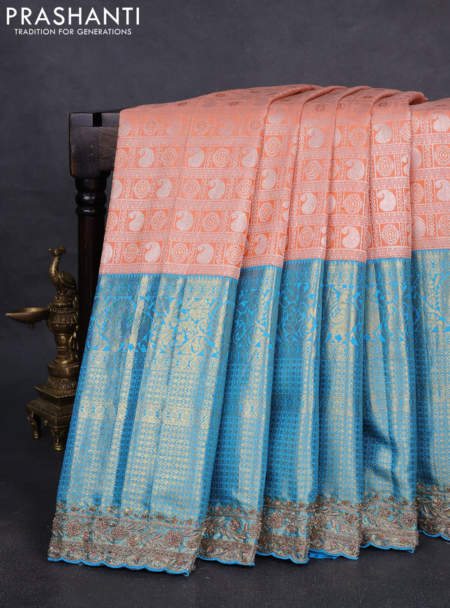 Kanchipuram silk saree cs blue and peach with allover zari woven brocade weaves and embroidered border