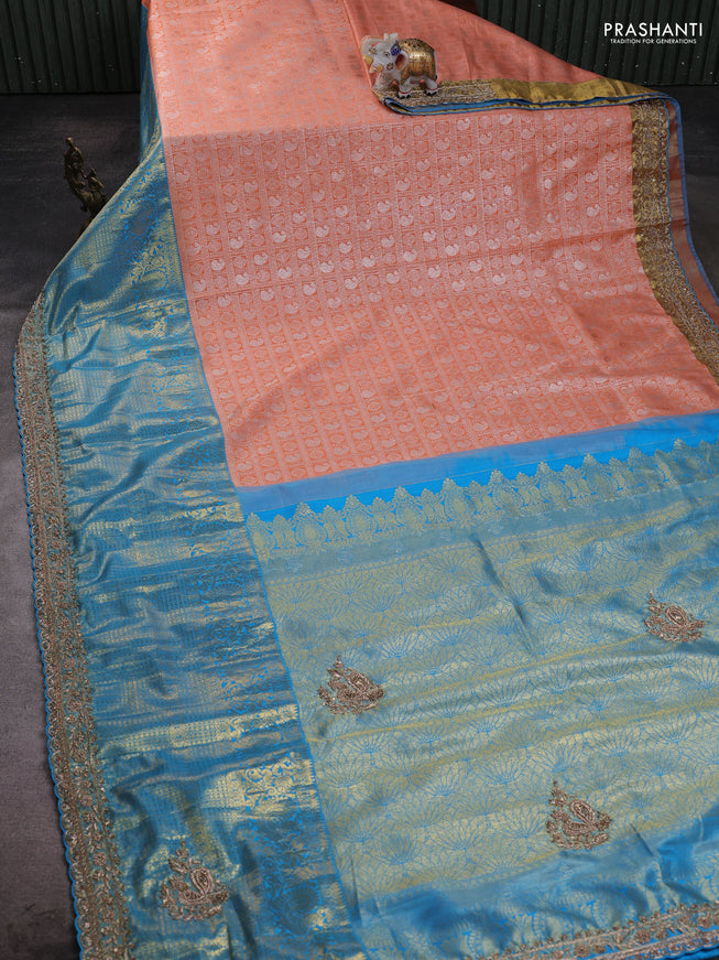 Kanchipuram silk saree cs blue and peach with allover zari woven brocade weaves and embroidered border