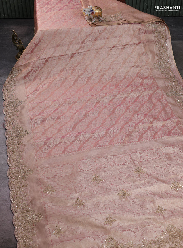 Kanchipuram silk saree mild peach with allover zari woven brocade weaves and embroidered border
