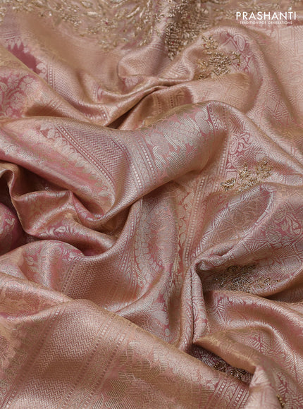 Kanchipuram silk saree mild peach with allover zari woven brocade weaves and embroidered border