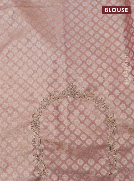 Kanchipuram silk saree mild peach with allover zari woven brocade weaves and embroidered border