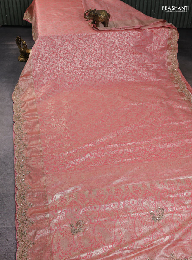 Kanchipuram silk saree peach pink with allover zari woven brocade weaves and embroidered border