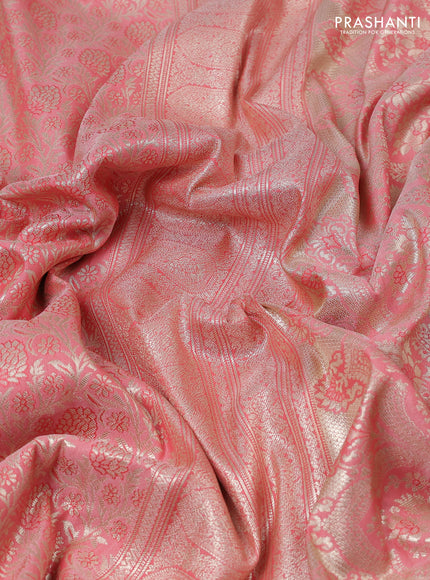 Kanchipuram silk saree peach pink with allover zari woven brocade weaves and embroidered border