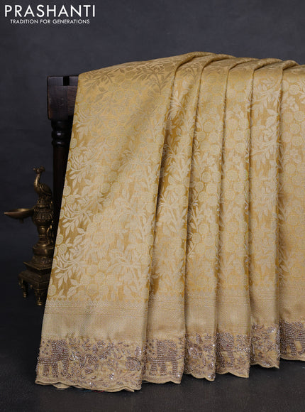 Kanchipuram silk saree gold with allover zari woven brocade weaves and embroidered border