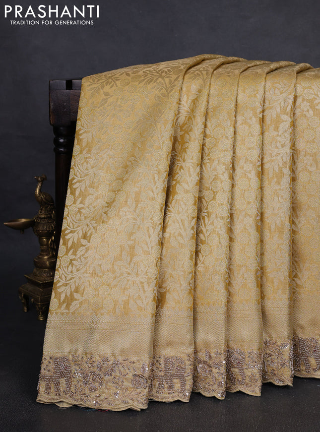 Kanchipuram silk saree gold with allover zari woven brocade weaves and embroidered border