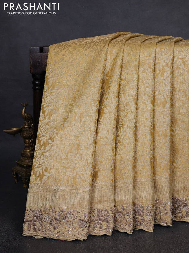 Kanchipuram silk saree gold with allover zari woven brocade weaves and embroidered border