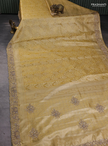 Kanchipuram silk saree gold with allover zari woven brocade weaves and embroidered border