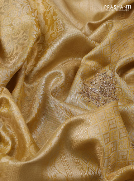 Kanchipuram silk saree gold with allover zari woven brocade weaves and embroidered border