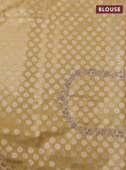 Kanchipuram silk saree gold with allover zari woven brocade weaves and embroidered border