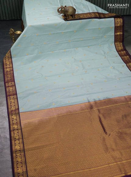 Semi kanchipuram silk saree pastel blue and deep wine with zari woven buttas and zari woven korvai border