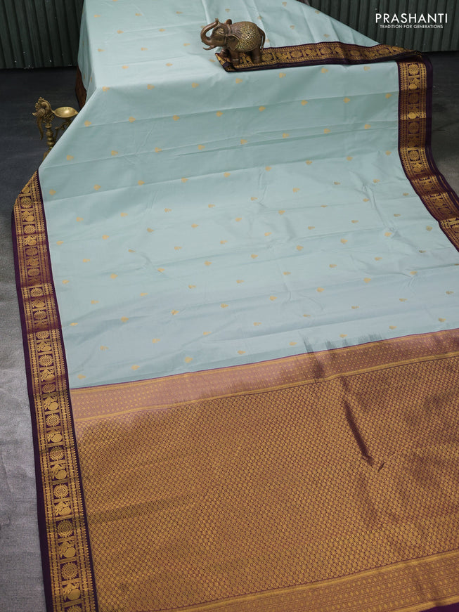 Semi kanchipuram silk saree pastel blue and deep wine with zari woven buttas and zari woven korvai border