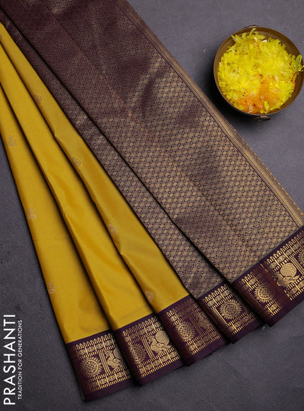 Semi kanchipuram silk saree yellow and deep wine with zari woven buttas and zari woven korvai border