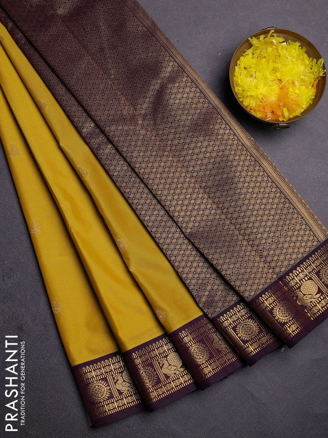 Semi kanchipuram silk saree yellow and deep wine with zari woven buttas and zari woven korvai border