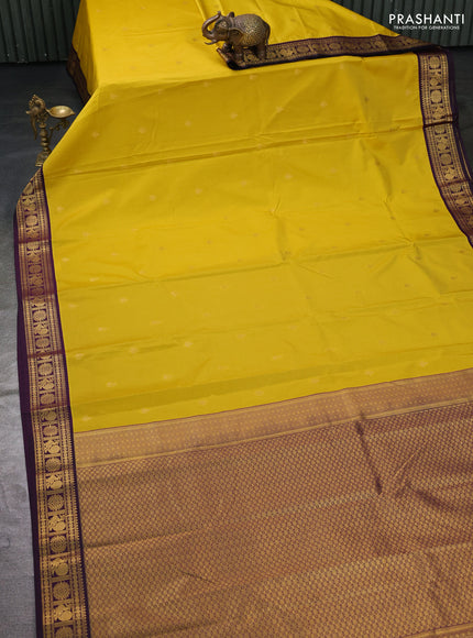 Semi kanchipuram silk saree yellow and deep wine with zari woven buttas and zari woven korvai border