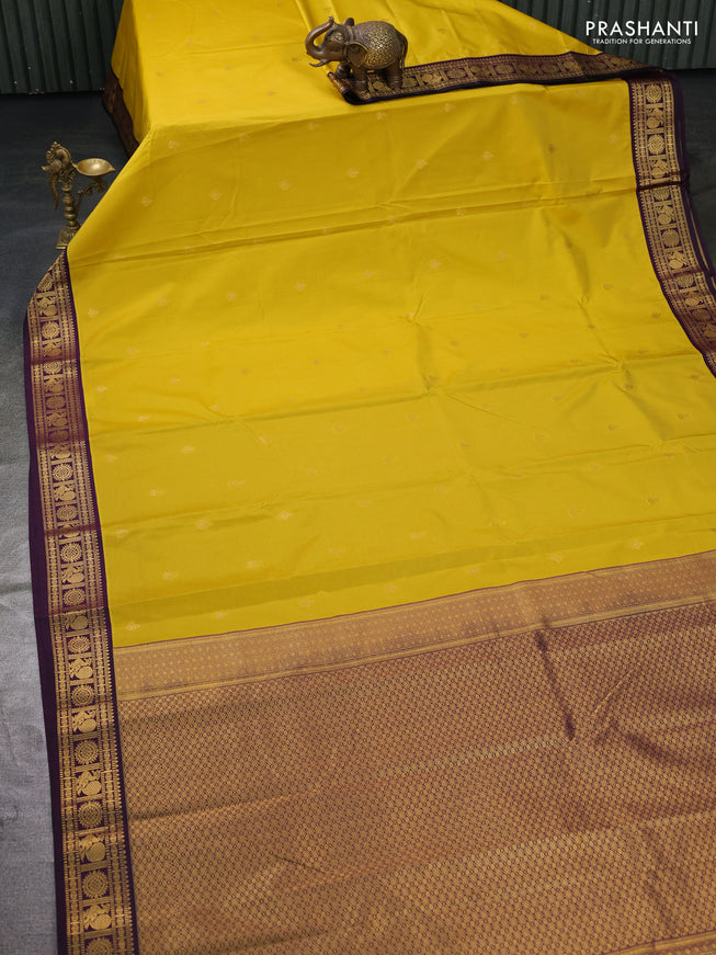 Semi kanchipuram silk saree yellow and deep wine with zari woven buttas and zari woven korvai border