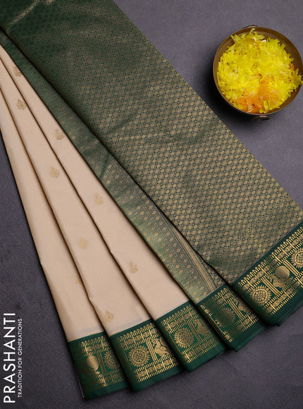 Semi kanchipuram silk saree cream and green with zari woven buttas and zari woven korvai border