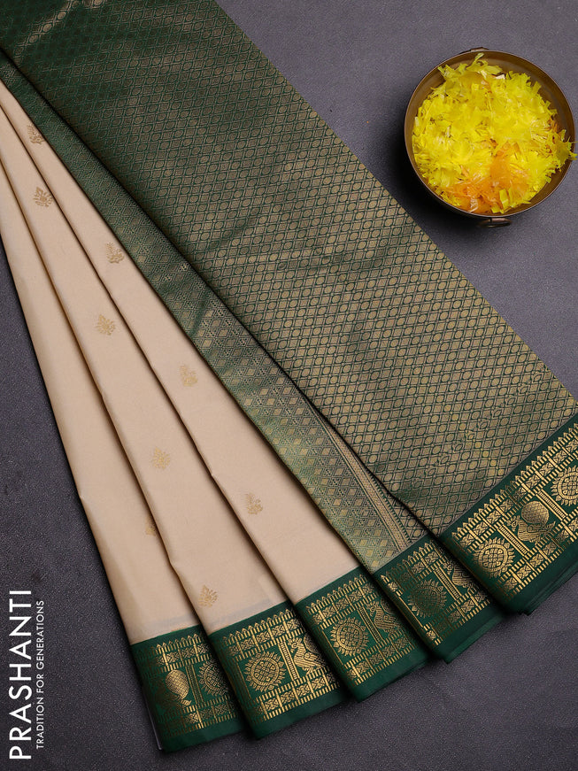 Semi kanchipuram silk saree cream and green with zari woven buttas and zari woven korvai border