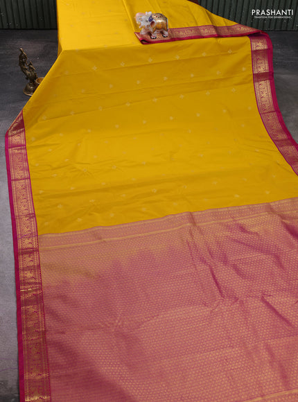 Semi kanchipuram silk saree yellow and pink with zari woven buttas and zari woven korvai border