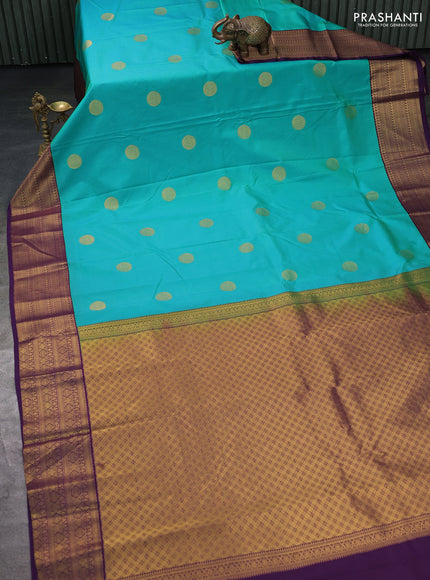 Semi kanchipuram silk saree teal green and deep violet with zari woven buttas and zari woven korvai border