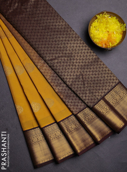 Semi kanchipuram silk saree yellow and coffee brown with zari woven buttas and zari woven korvai border