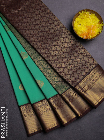 Semi kanchipuram silk saree green and coffee brown with zari woven buttas and zari woven korvai border