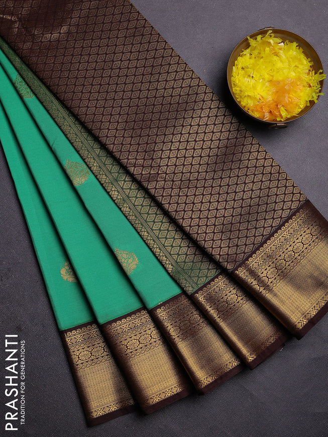 Semi kanchipuram silk saree green and coffee brown with zari woven buttas and zari woven korvai border