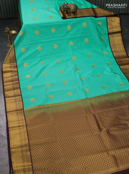 Semi kanchipuram silk saree green and coffee brown with zari woven buttas and zari woven korvai border