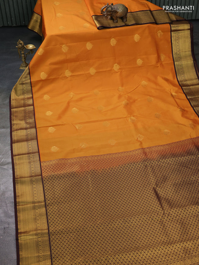 Semi kanchipuram silk saree dark mustard and brown with zari woven buttas and zari woven korvai border