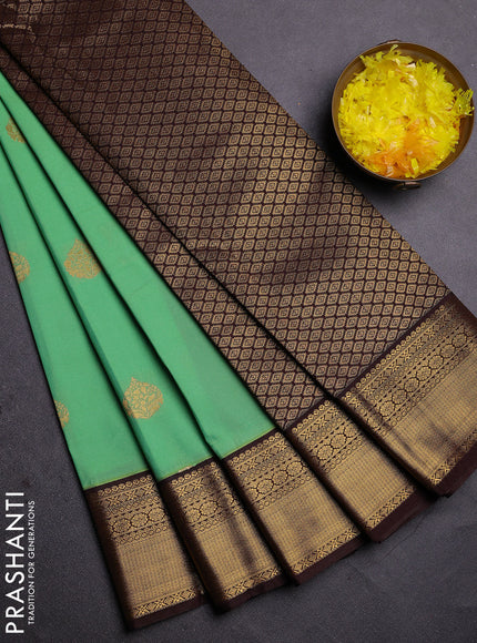 Semi kanchipuram silk saree teal green and brown with zari woven buttas and zari woven korvai border