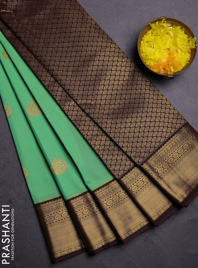 Semi kanchipuram silk saree teal green and brown with zari woven buttas and zari woven korvai border