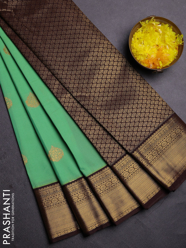Semi kanchipuram silk saree teal green and brown with zari woven buttas and zari woven korvai border