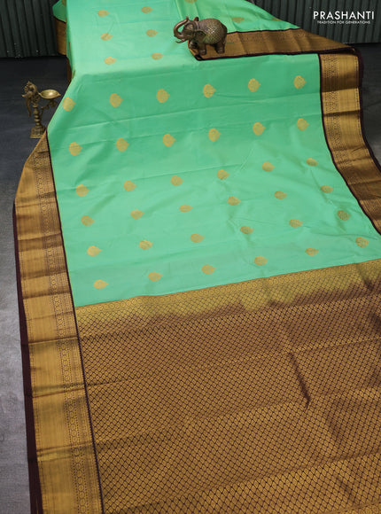 Semi kanchipuram silk saree teal green and brown with zari woven buttas and zari woven korvai border