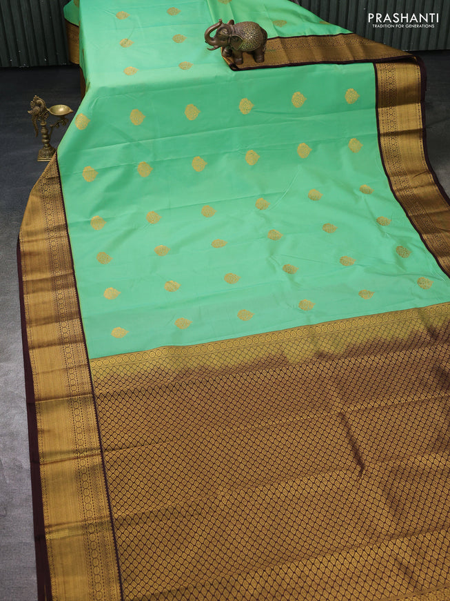 Semi kanchipuram silk saree teal green and brown with zari woven buttas and zari woven korvai border