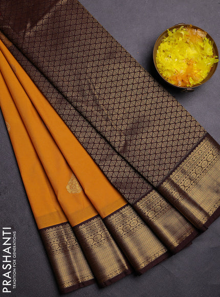 Semi kanchipuram silk saree yellow and brown with zari woven buttas and zari woven korvai border