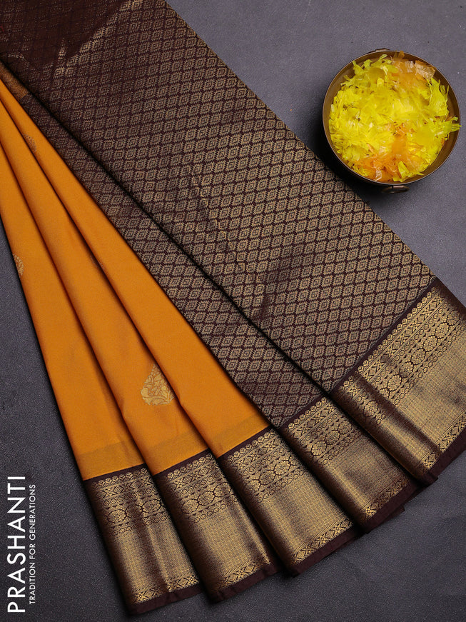 Semi kanchipuram silk saree yellow and brown with zari woven buttas and zari woven korvai border