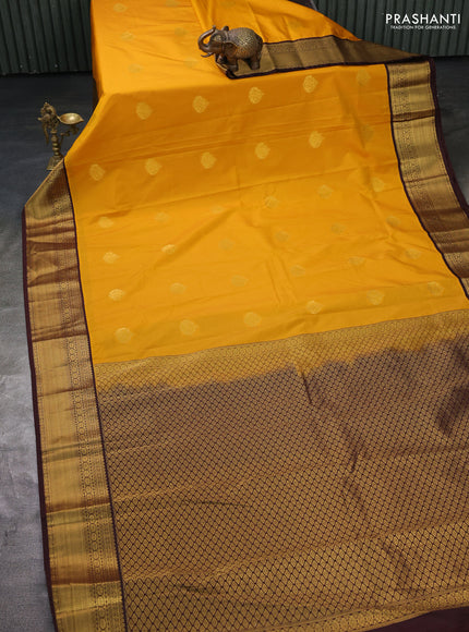 Semi kanchipuram silk saree yellow and brown with zari woven buttas and zari woven korvai border