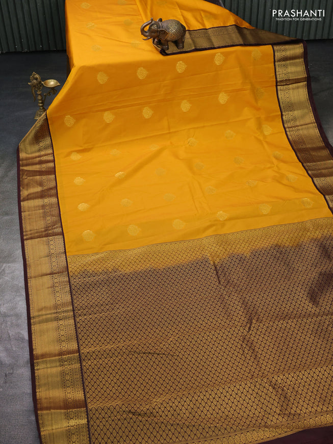 Semi kanchipuram silk saree yellow and brown with zari woven buttas and zari woven korvai border
