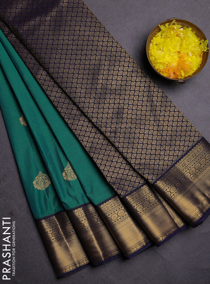 Semi kanchipuram silk saree green and navy blue with zari woven buttas and zari woven korvai border