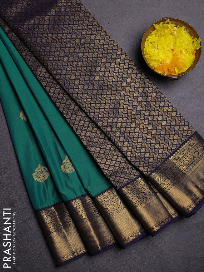 Semi kanchipuram silk saree green and navy blue with zari woven buttas and zari woven korvai border