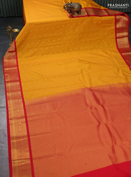 Semi kanchipuram silk saree mustard yellow and red with zari woven buttas and zari woven korvai border