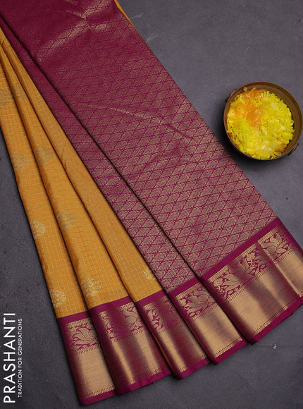 Semi kanchipuram silk saree mustard yellow and purple with allover zari checks & buttas and zari woven korvai border