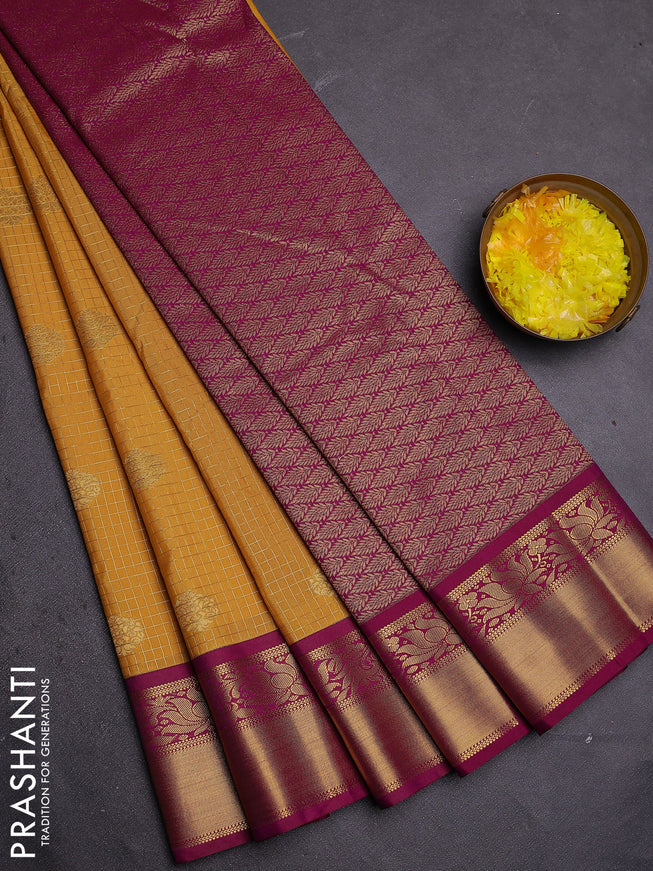 Semi kanchipuram silk saree mustard yellow and purple with allover zari checks & buttas and zari woven korvai border